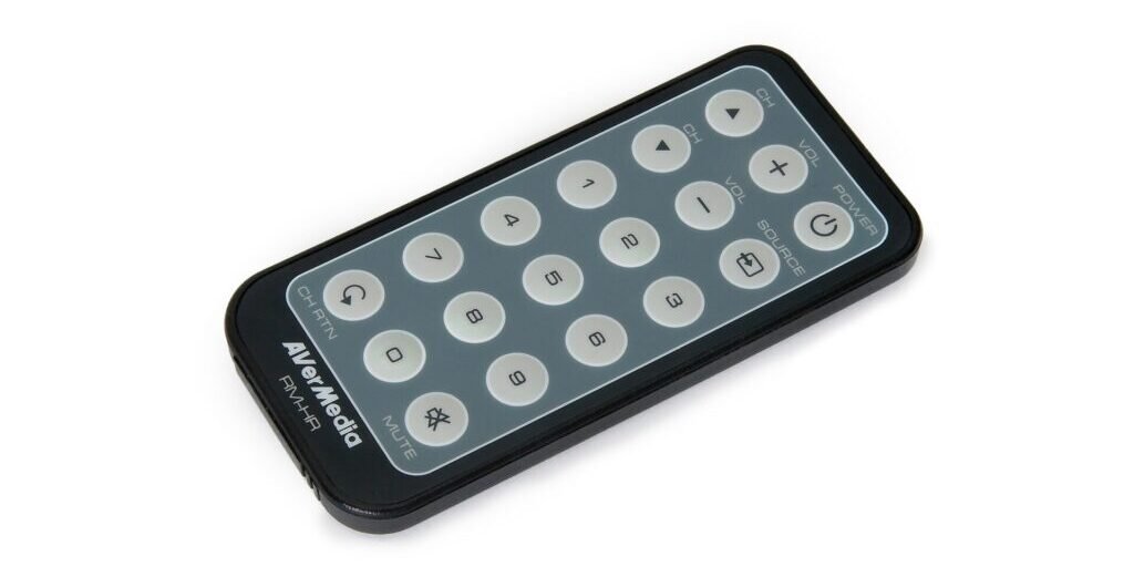 Close-up of a black AverMedia TV tuner remote control with numbered buttons on a white background.