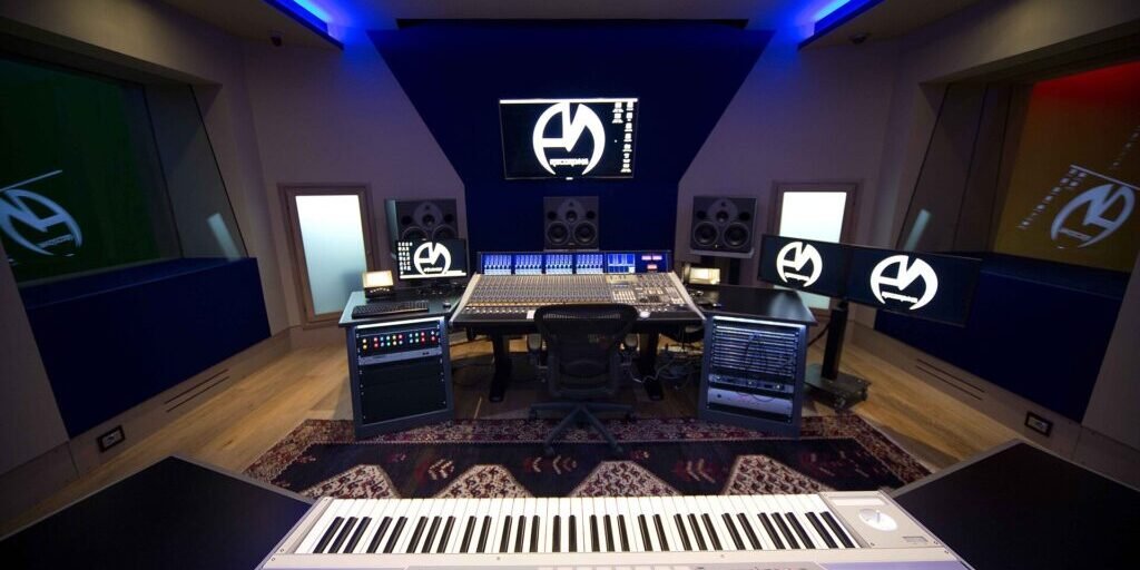Professional audio control room with mixing console and monitoring equipment