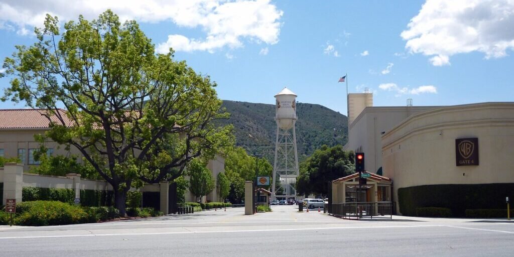 Warner Bros. Studios Gate 4 in Burbank with the distinctive water tower and surrounding buildings