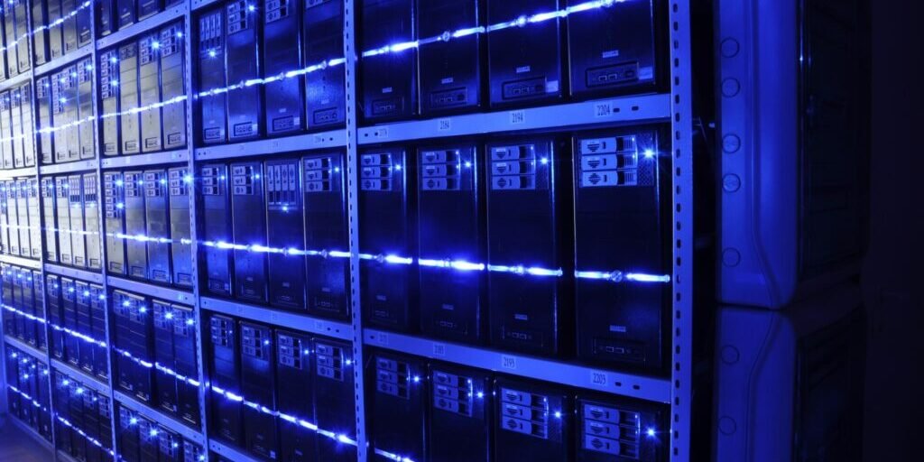 Blue-lit server racks in a data center
