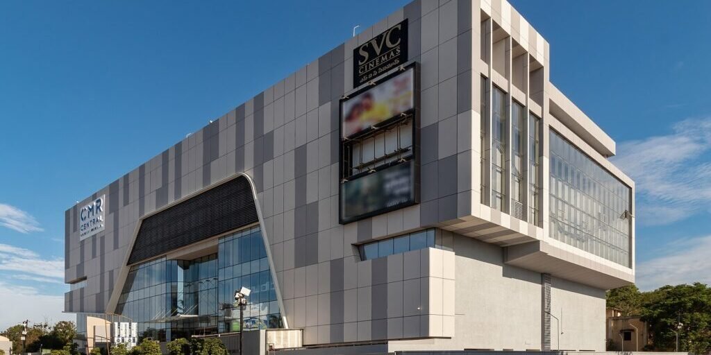 Modern multiplex cinema building with glass facades and signage