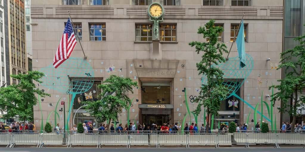 Tiffany & Co. flagship store facade on Fifth Avenue with turquoise storefront and ivy wall design