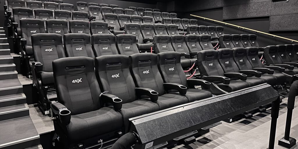 Rows of 4DX motion-enabled cinema seats in an auditorium