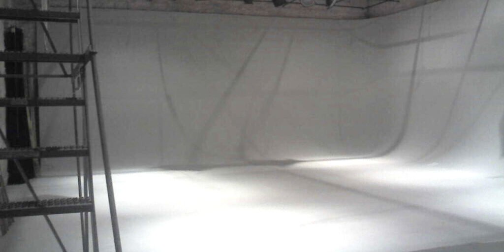 Empty sound stage interior with professional lighting rigs