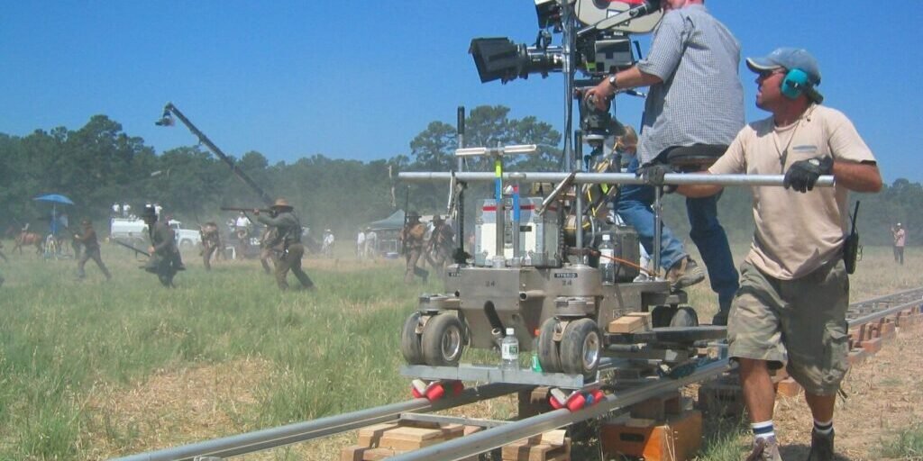 Film crew operating professional cameras on a movie set